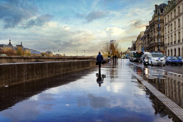 man walking beside the street