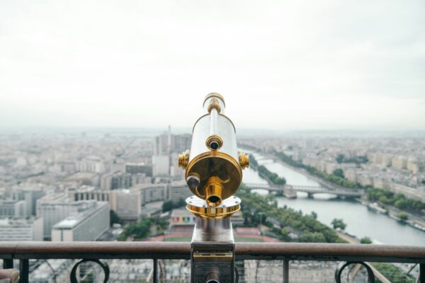 gray and gold-colored telescope on roof