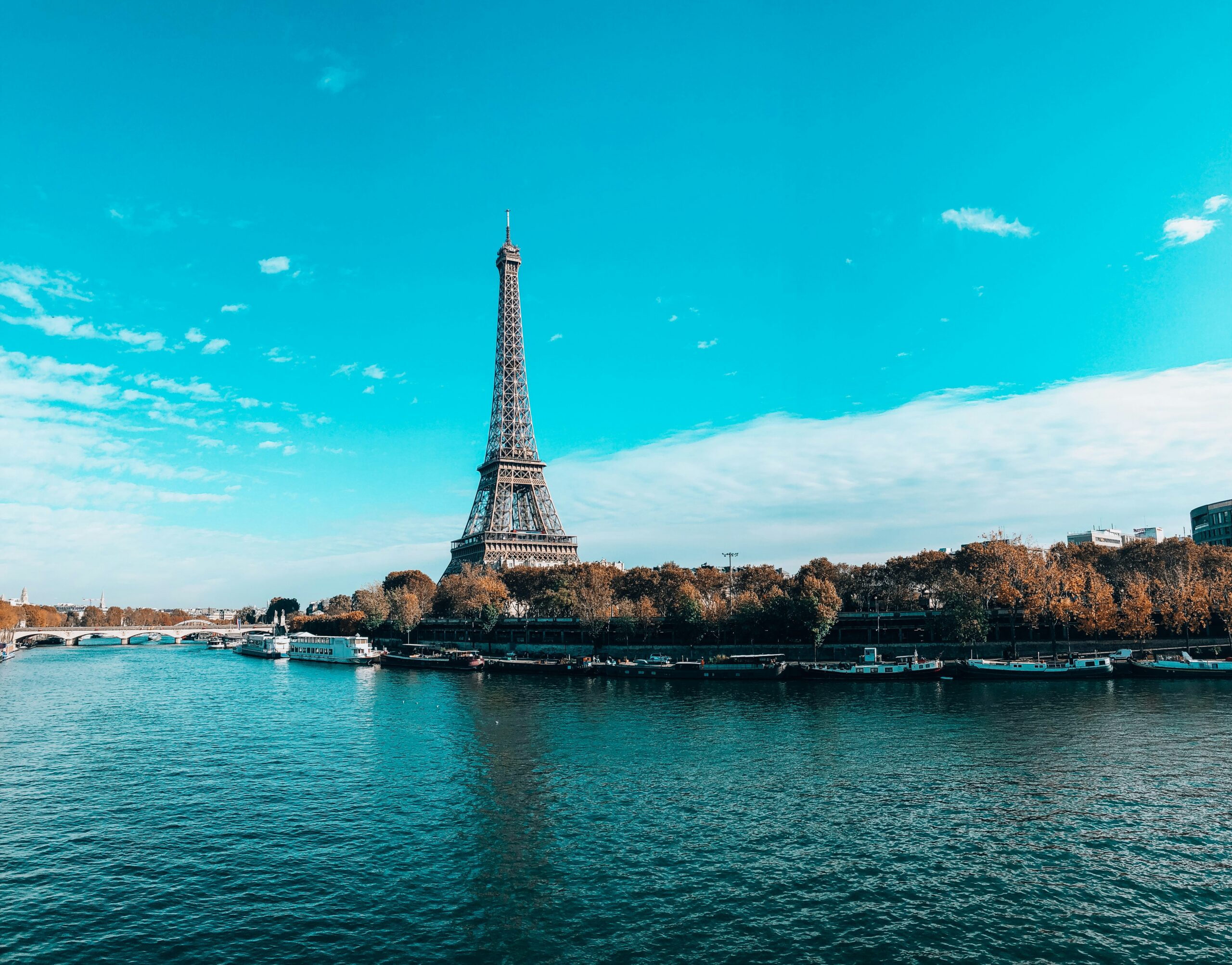 eiffel tower near body of water during daytime