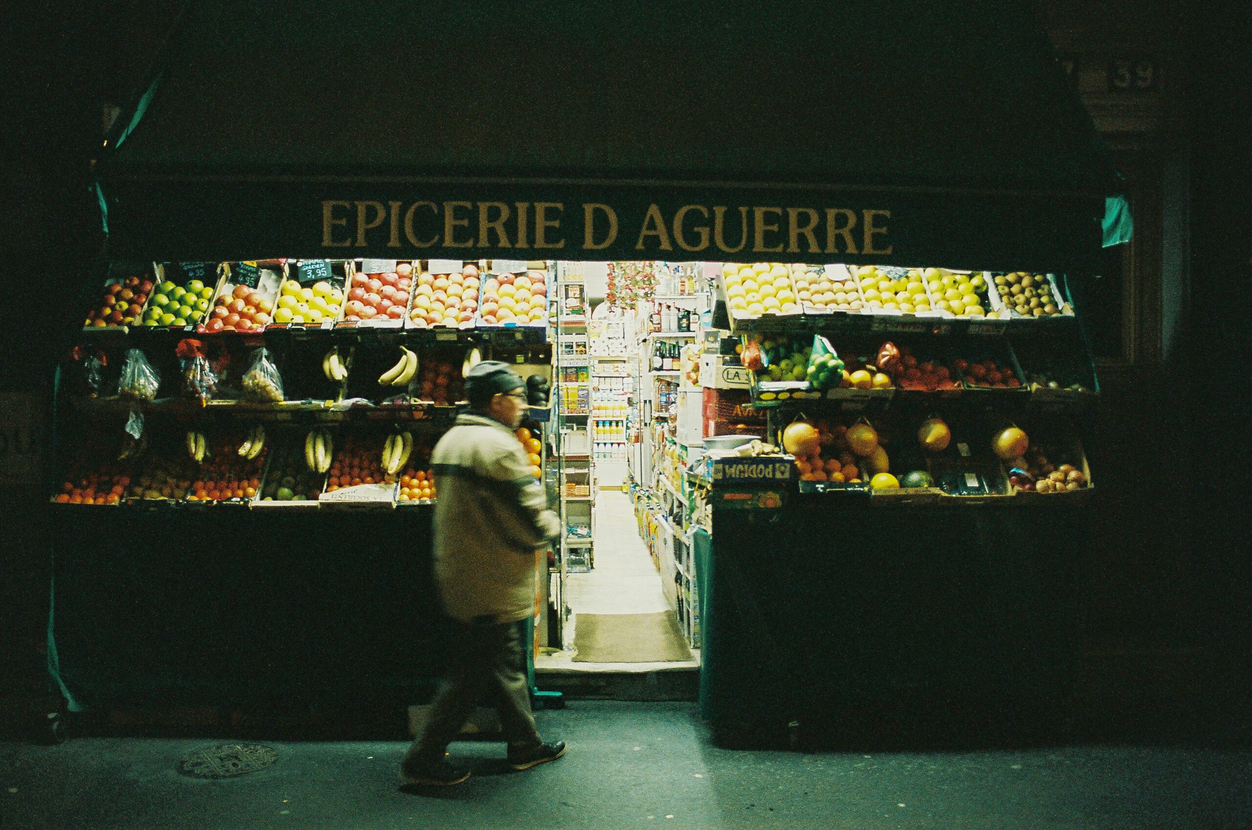 woman in white long sleeve shirt and black pants standing in front of black and white