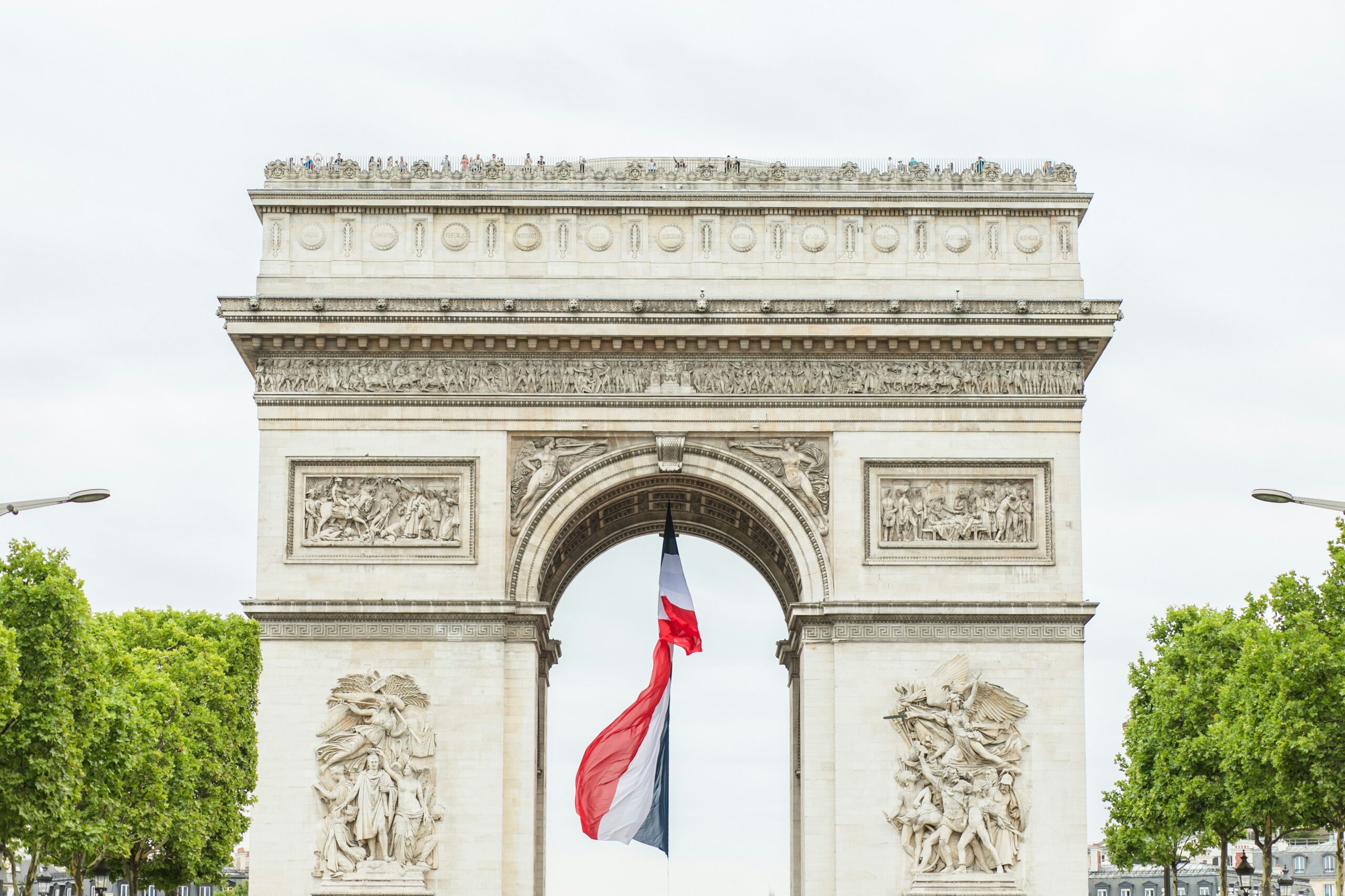 white concrete arch with us flag