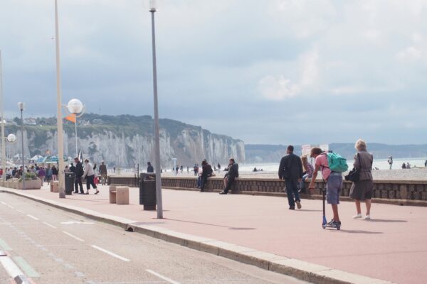 people walking on gray concrete road during daytime