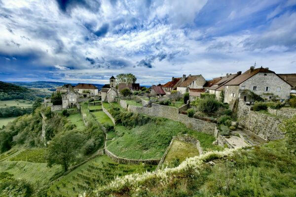 A scenic view of a village on a hill