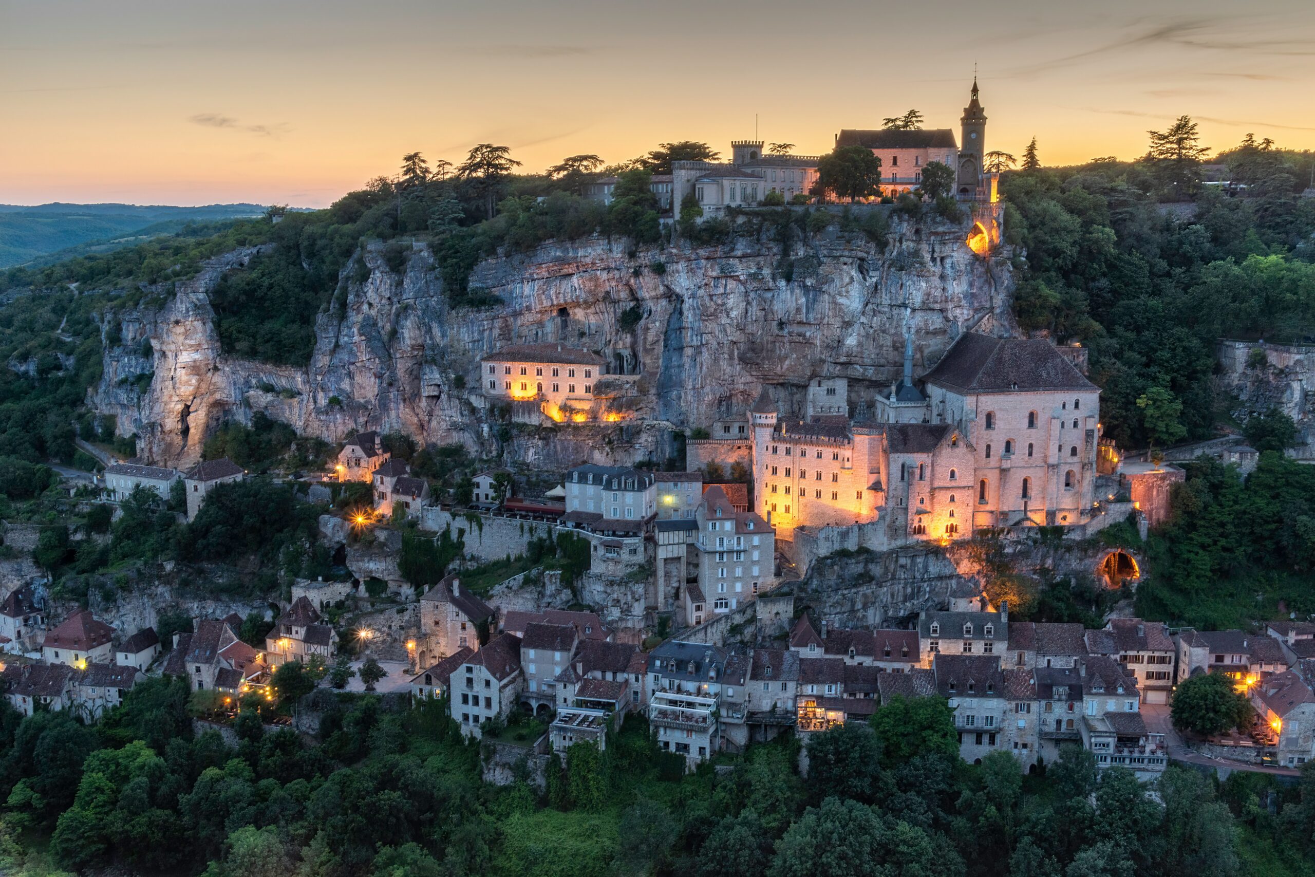 a village on top of a mountain at night