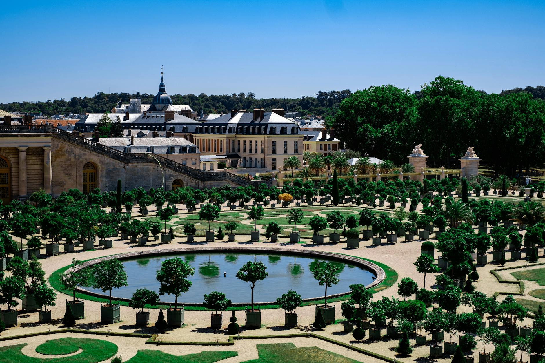 A stunning view of the landscaped gardens at the Palace of Versailles, showcasing symmetry and design.