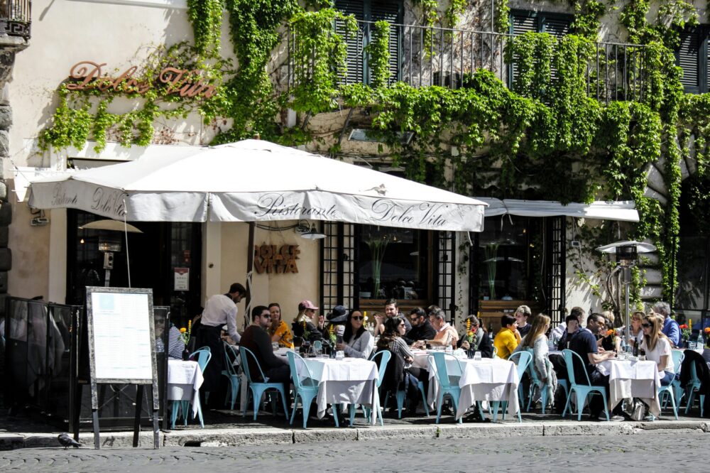 What are the typical prices for meals and drinks in Rome restaurants?