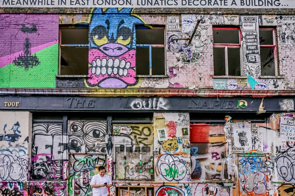 What is the best way to experience London's street art?