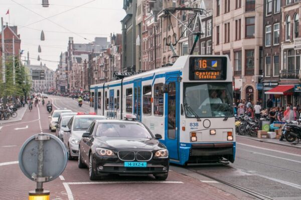 How do I register with the municipality in Amsterdam?